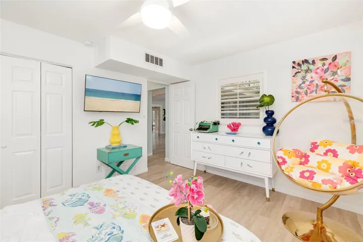 This bedroom is just off the living room with great windows. and plantation shutters