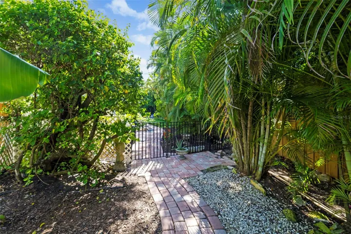 Walk through this gate to your lush, tropical backyard