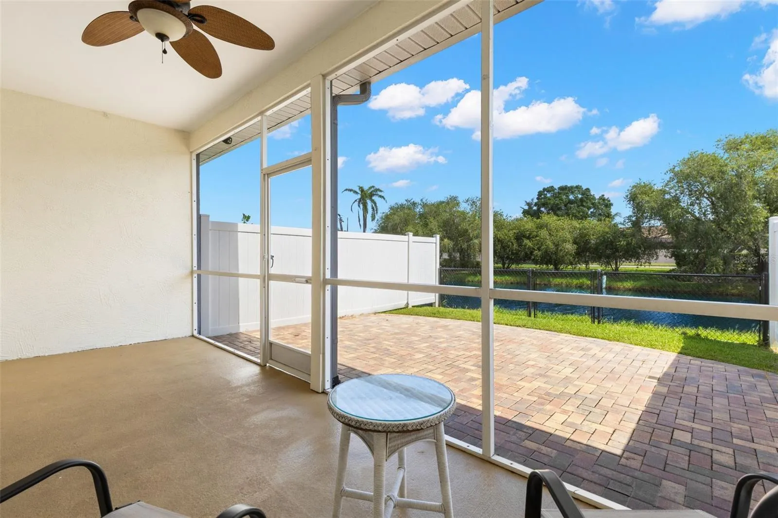 Fenced in backyard with water views