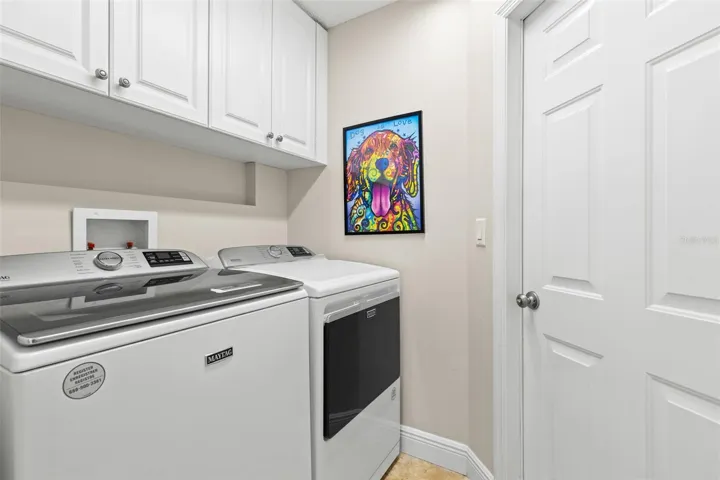 Laundry room with access to one-car garage