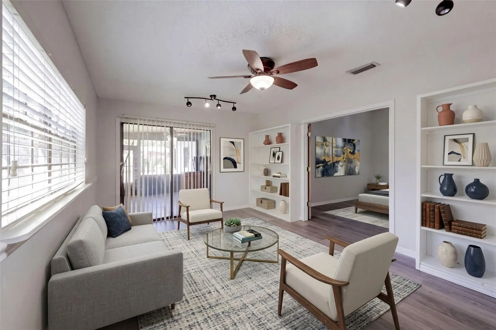 Florida room off master bedroom - virtually staged as a sitting area.