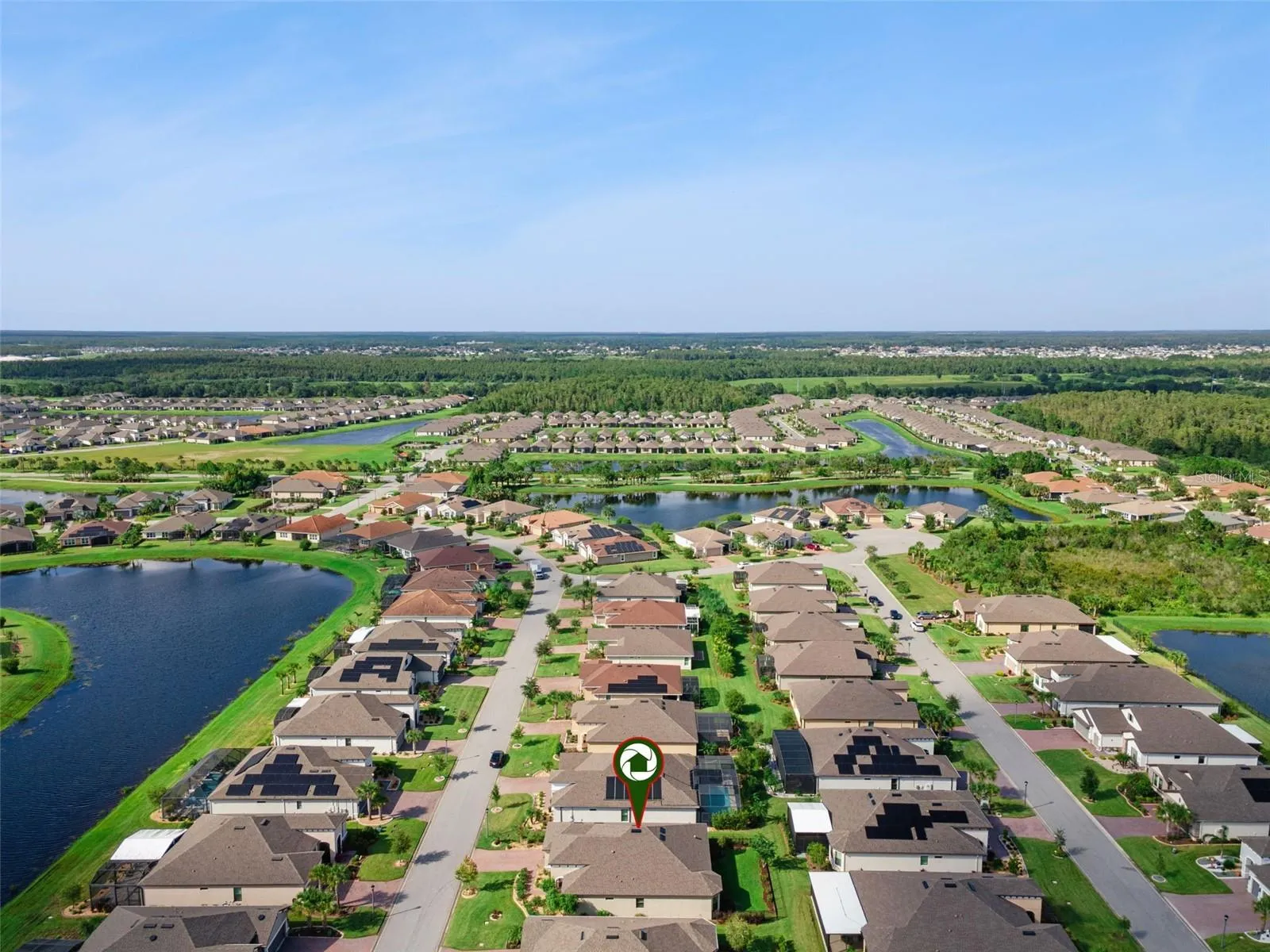 Aerial view of Solivita, one of the Orlando area's premier 55+ active adult communities, with scenic ponds and green space.
