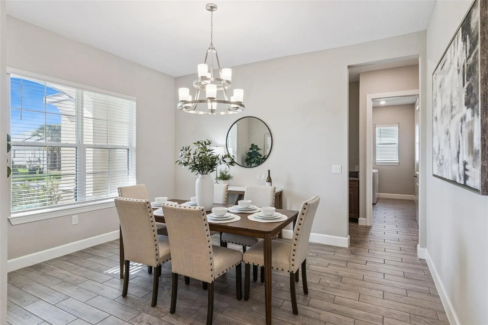 Separate dining room with chandelier, a dedicated setting for holidays and gatherings.