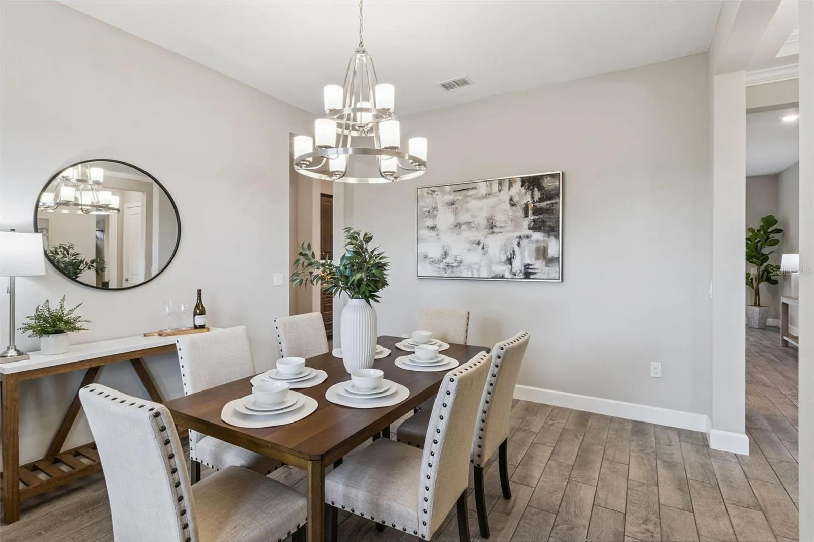 Dining room with chandelier, ready for holiday dinners and everyday meals.