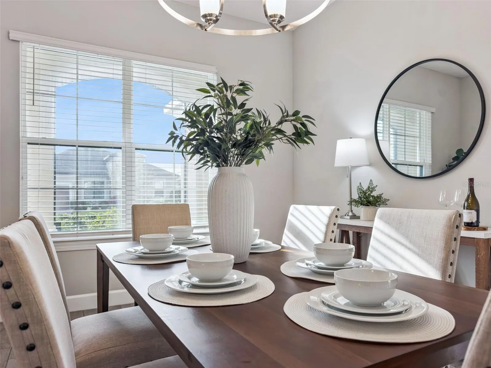 Dining room detail with sunny windows and room for family and friends.