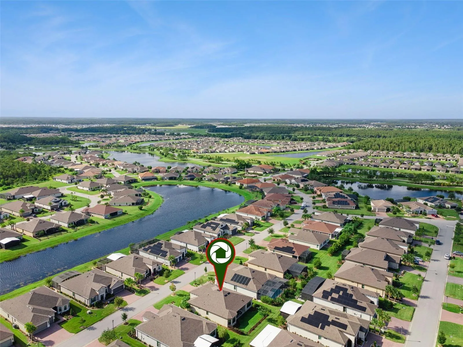 Solivita community aerial. Residents enjoy Stonegate Golf Club with 36 championship holes, resort style pools, and pickleball.
