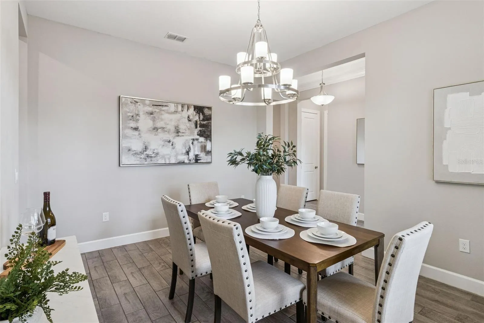 Alternate view of the separate dining room with abundant natural light.
