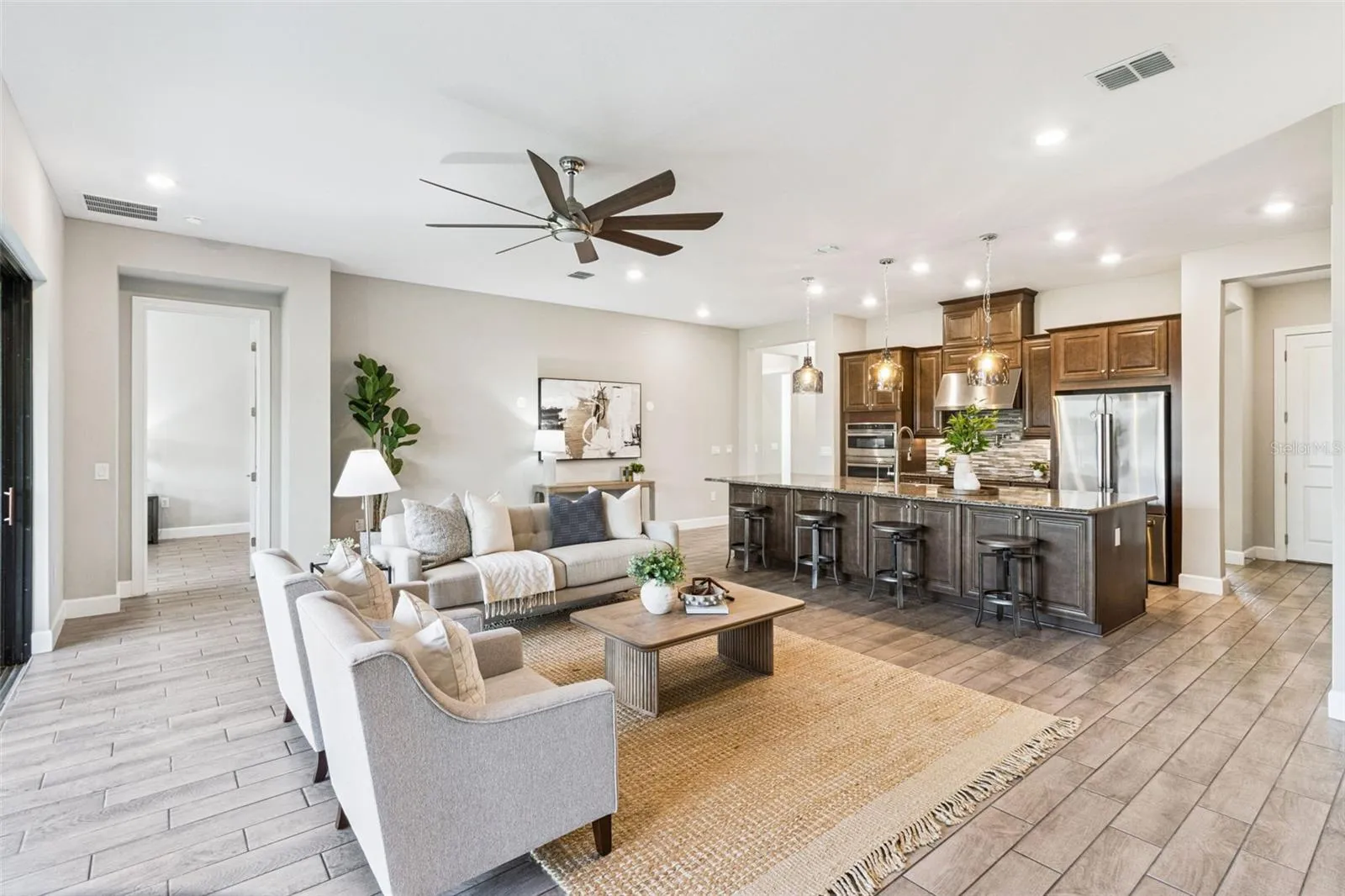Expansive great room view toward the kitchen and dining areas.