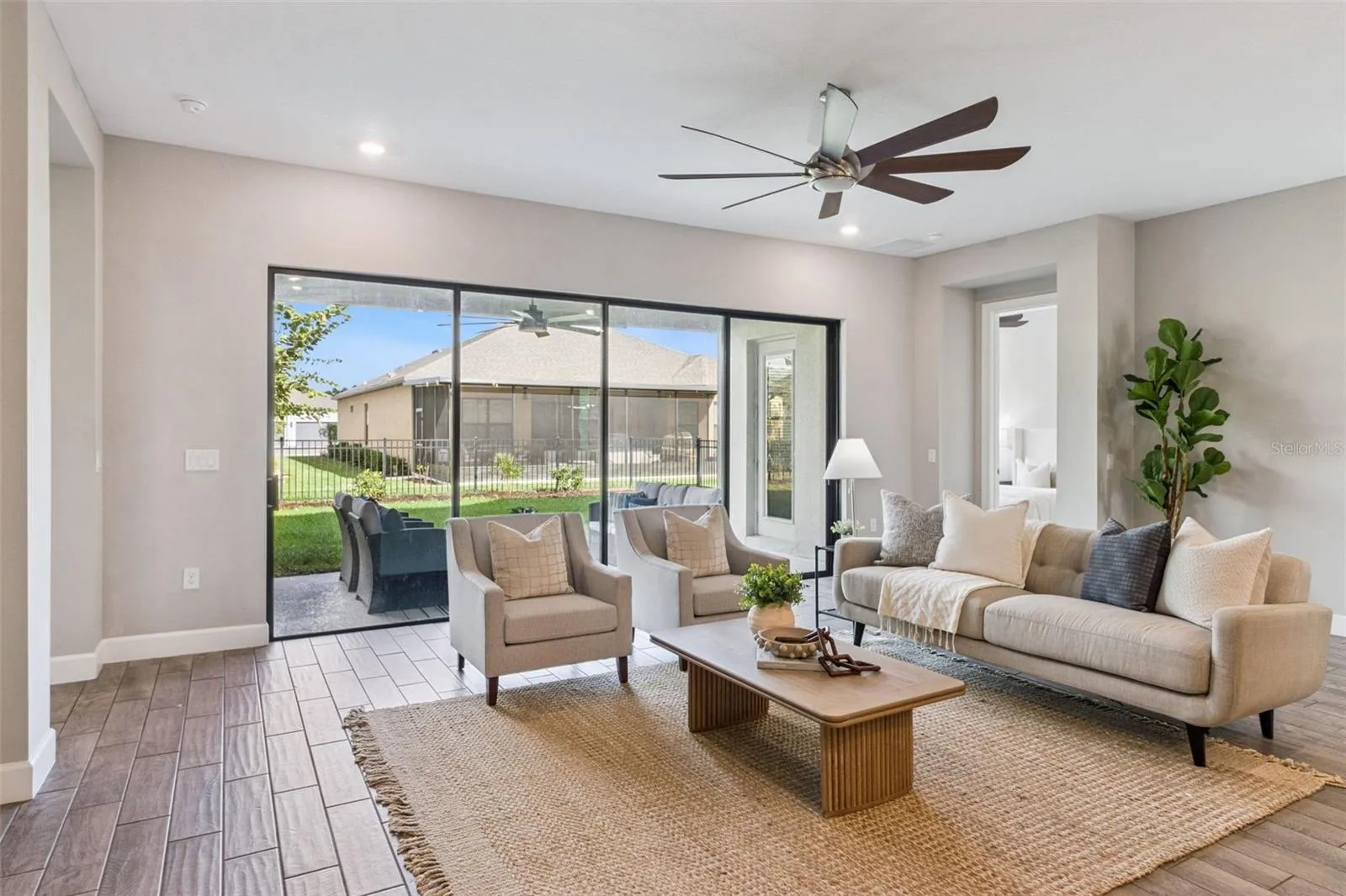 Family room with sliding glass doors opening to the private fenced patio.