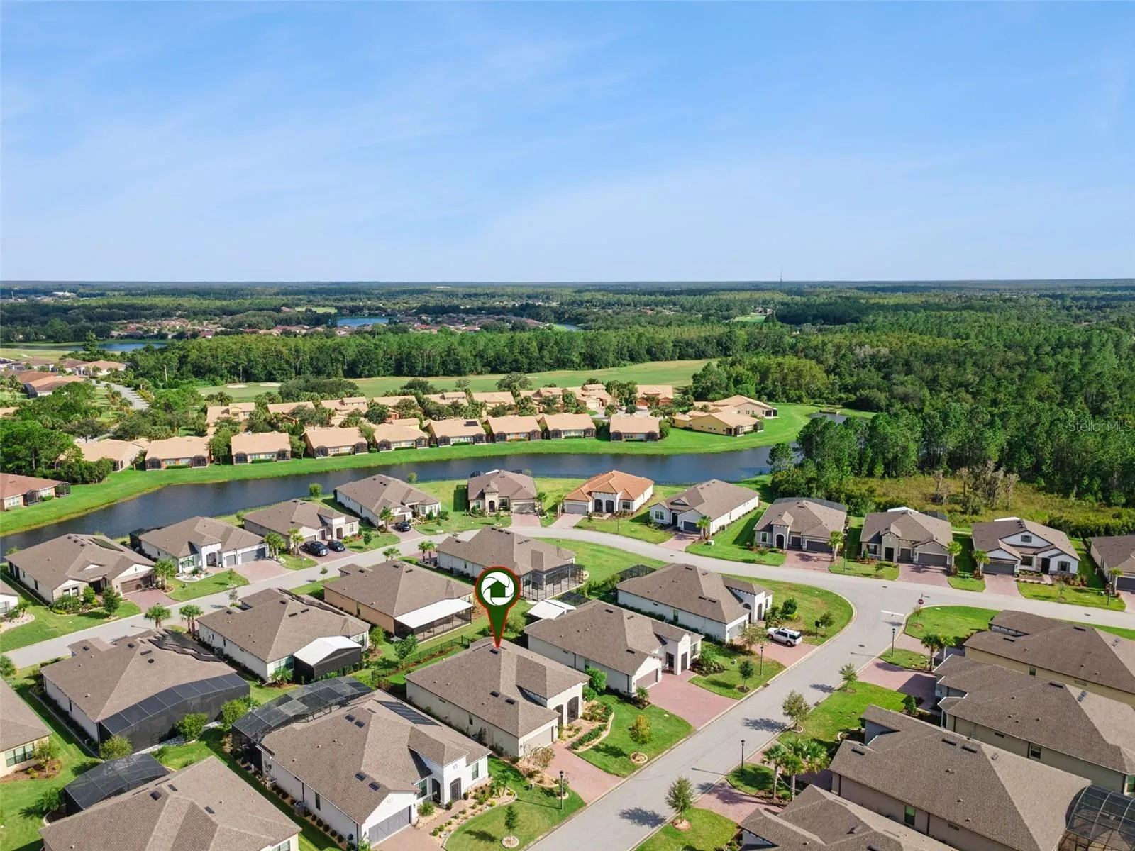 Solivita neighborhood aerial, convenient to Orlando International Airport, Walt Disney World, and major Central Florida highways.