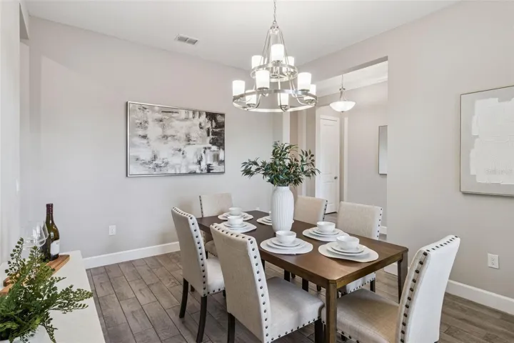 Alternate view of the separate dining room with abundant natural light.