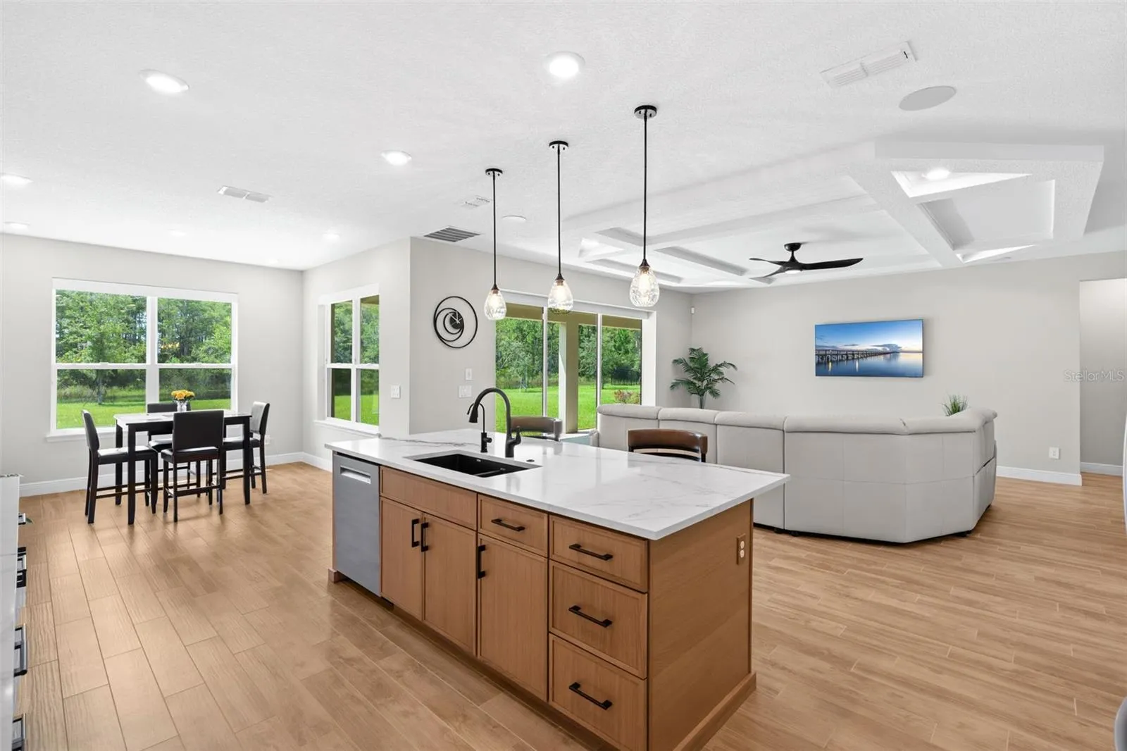 Open kitchen, spacious living and casual breakfast nook.
