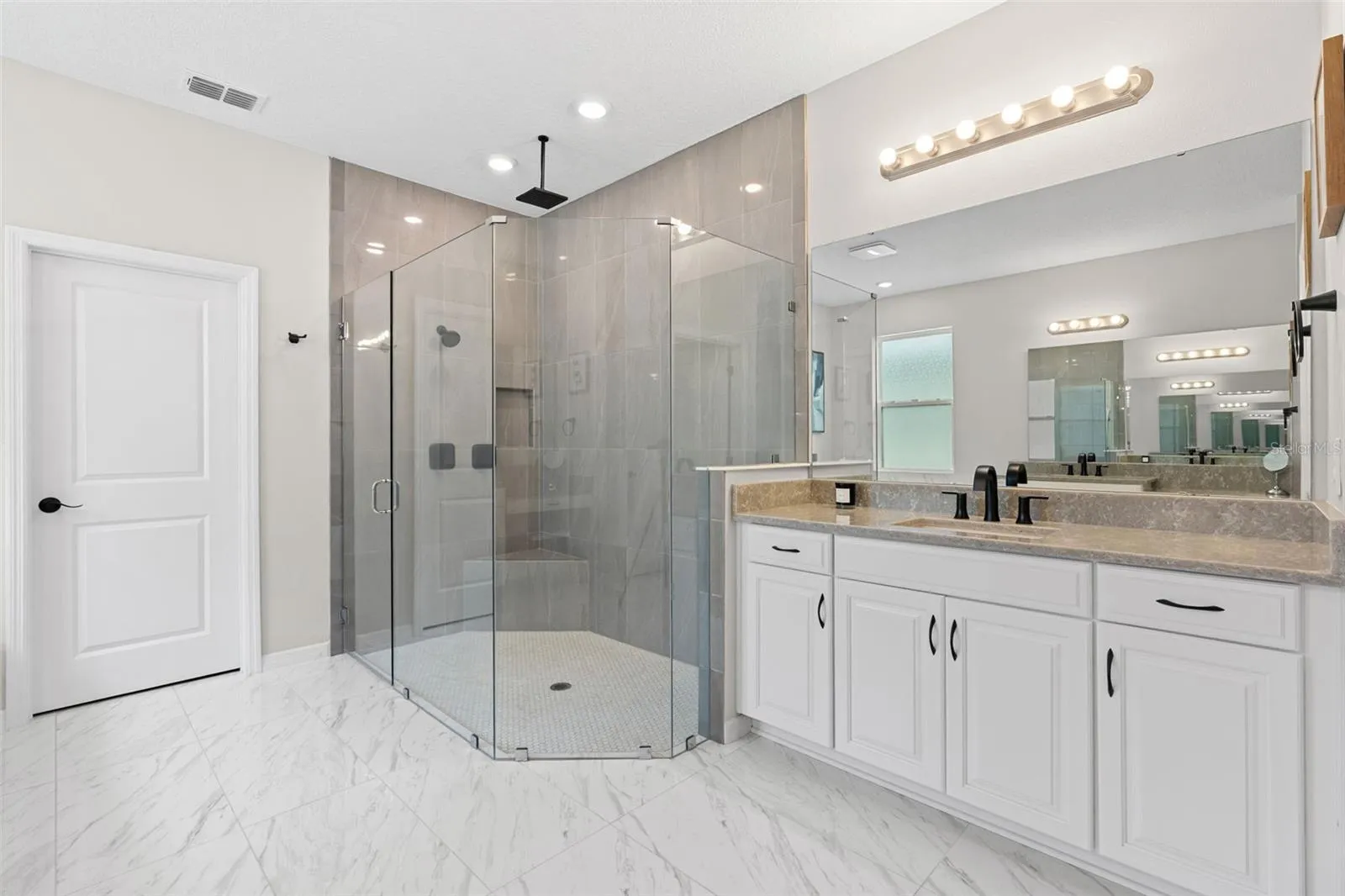 Custom oversized walk-in seamless glass shower.