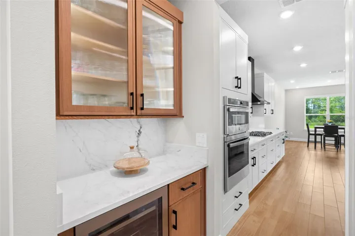 Butler's pantry between accesses the formal dining and kitchen.