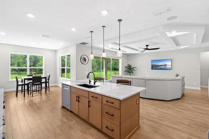 Open kitchen, spacious living and casual breakfast nook.
