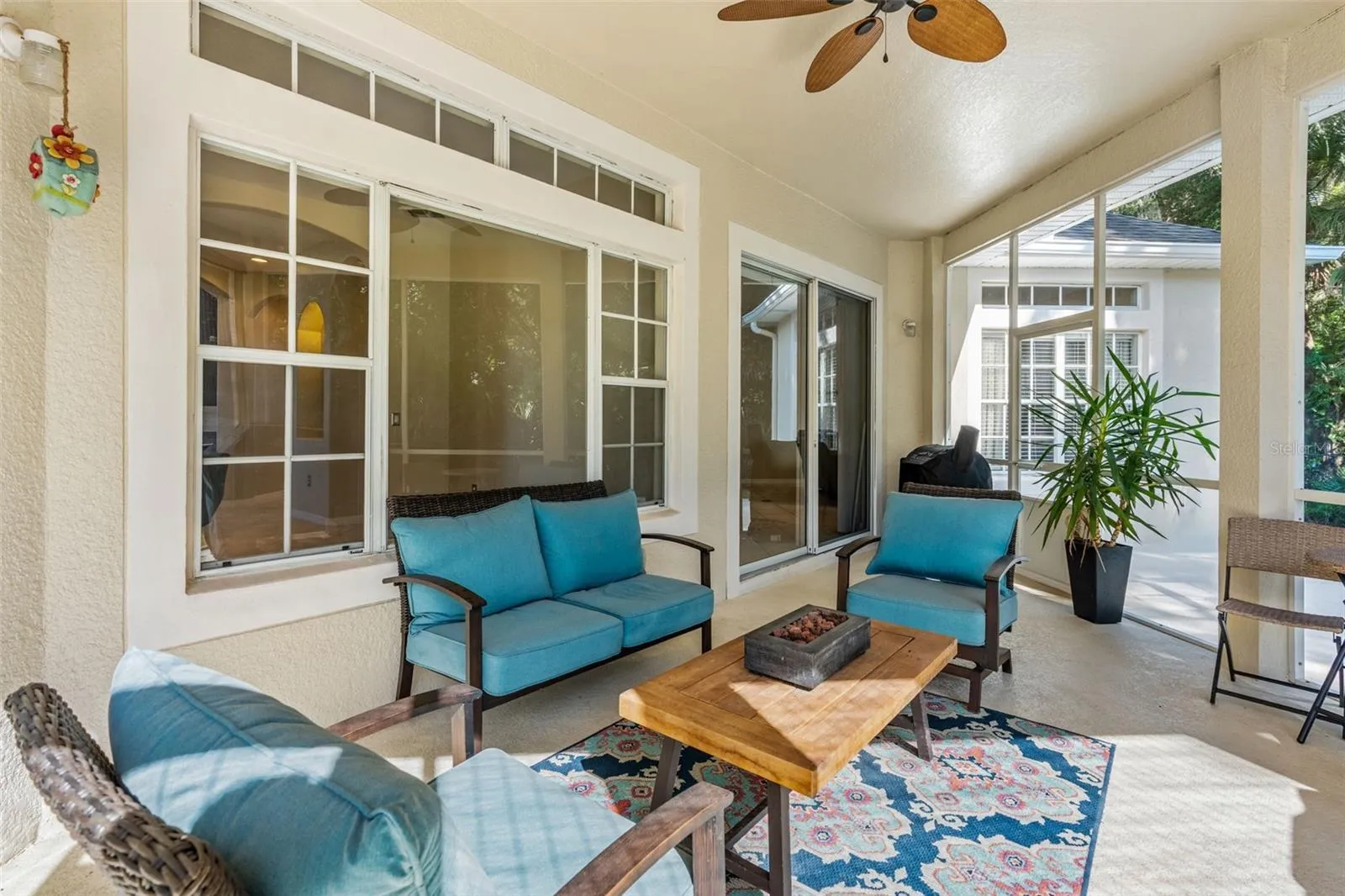 Step onto the COVERED & SCREENED LANAI and enjoy peaceful views across the backyard toward the surrounding conservation area.