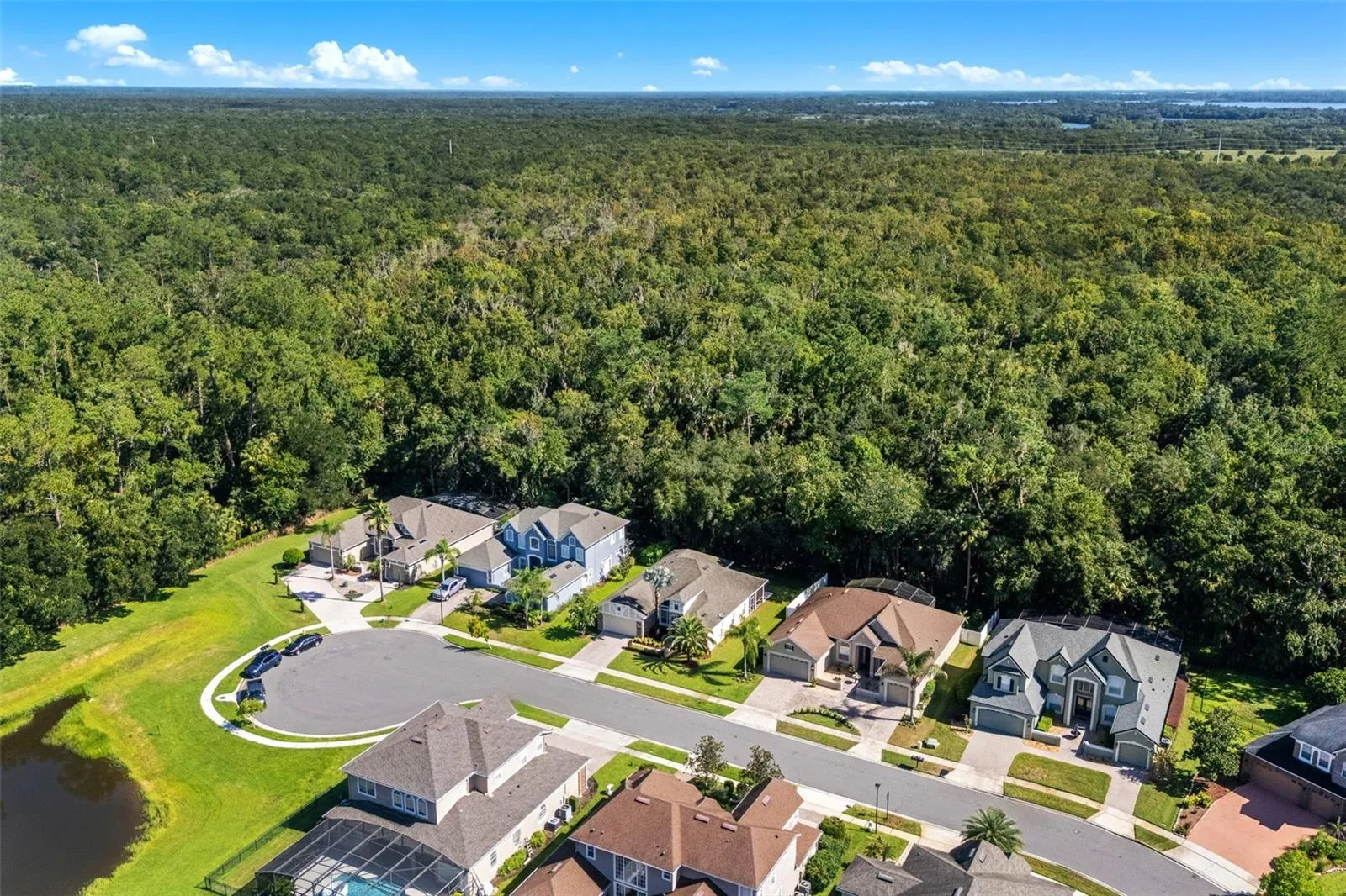 Aerial view of the front of the home and neighborhood.