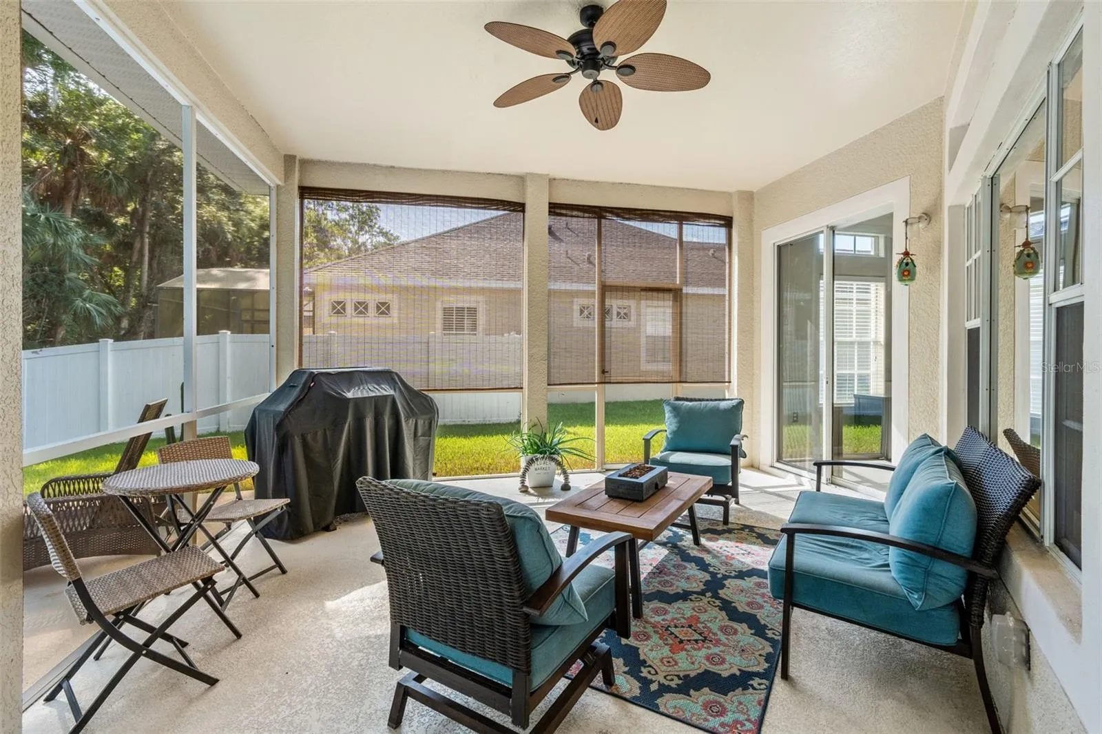 Step onto the COVERED & SCREENED LANAI and enjoy peaceful views across the backyard toward the surrounding conservation area.