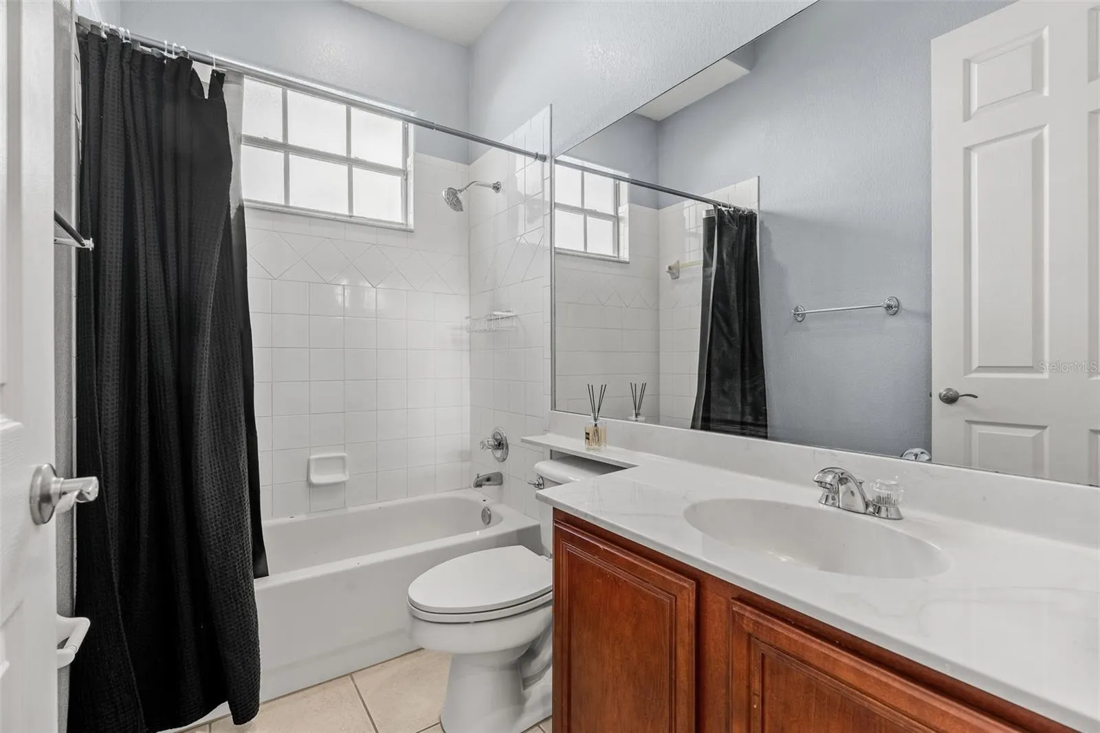 Three additional Bedrooms are located in separate areas of the home and are complemented by TWO ADDITIONAL FULL BATHS, providing plenty of room for family, guests or a home office.