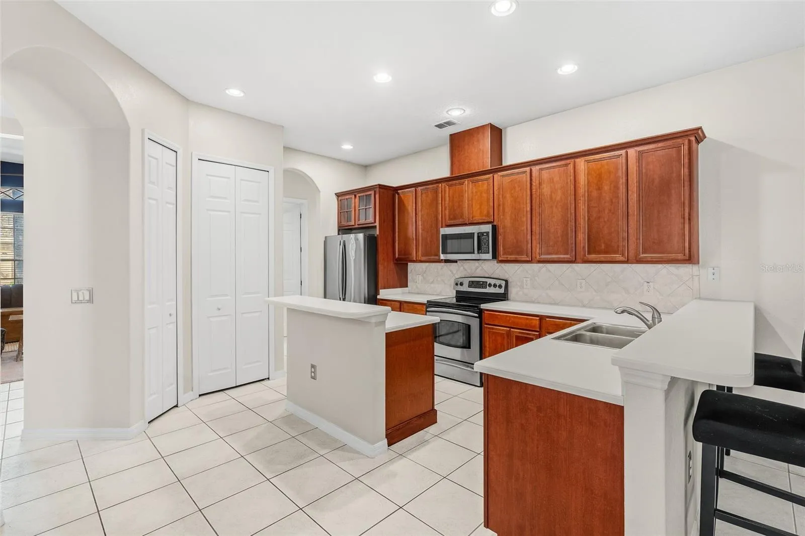The main living area brings the KITCHEN, FAMILY ROOM and DINING AREA together in an inviting space.