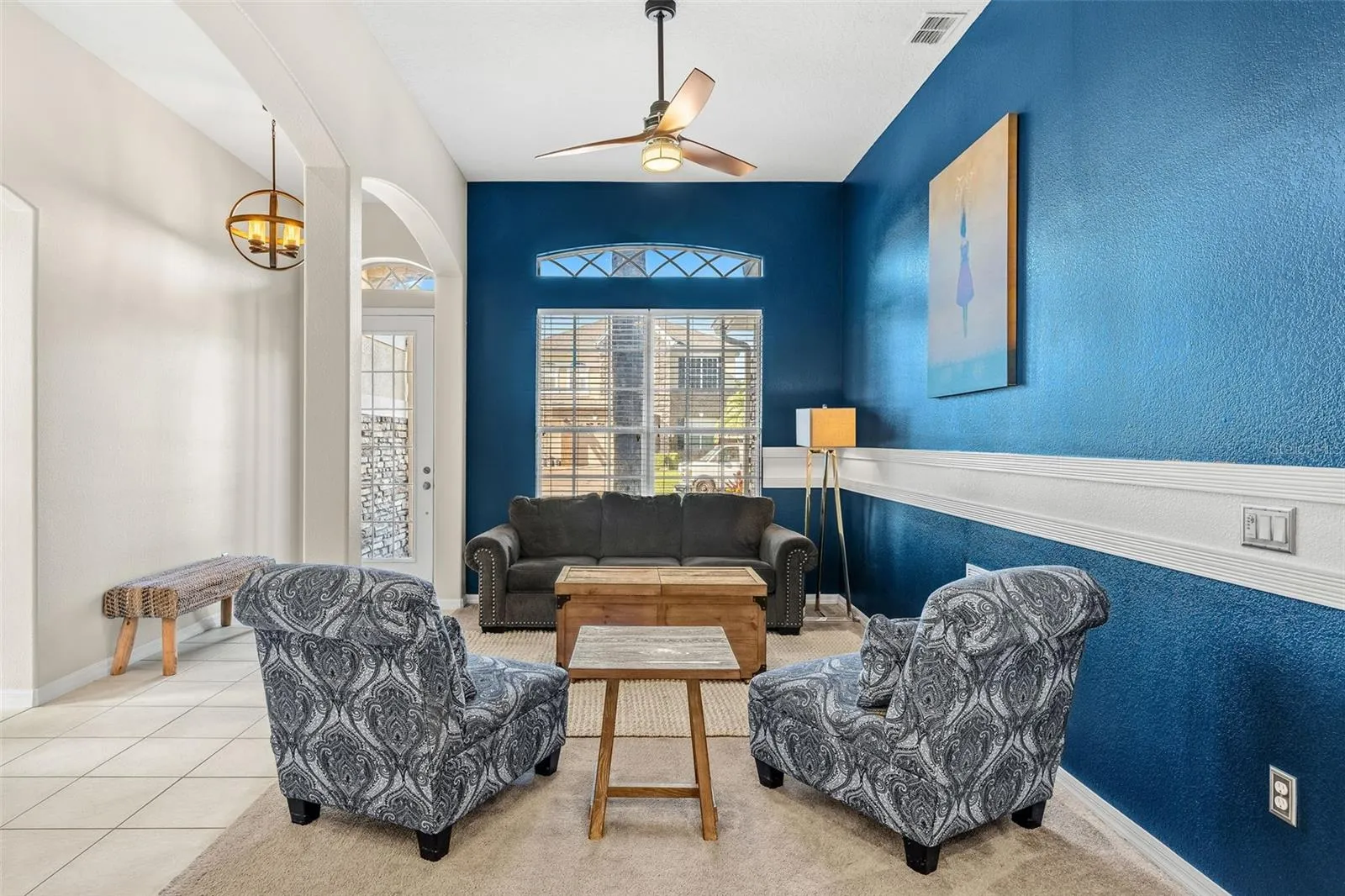 The thoughtful 3-WAY SPLIT FLOOR PLAN offers exceptional flexibility and privacy with a FORMAL LIVING ROOM positioned toward the front of the home.