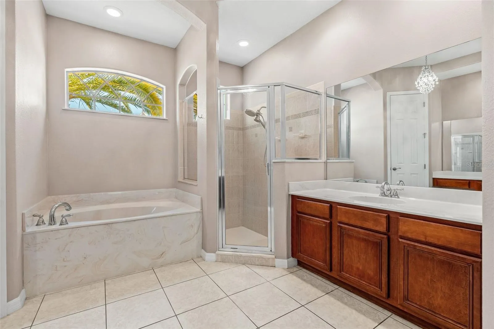 The Primary en-suite bath boasts a GARDEN TUB, STEP-IN SHOWER, DUAL VANITIES and a PRIVATE WATER CLOSET.