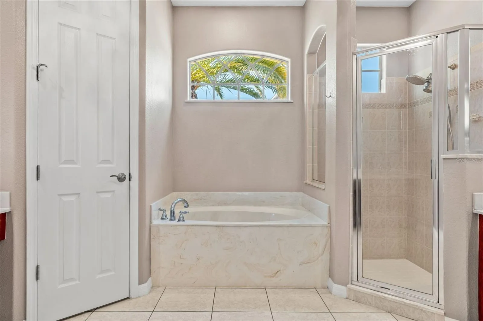 The Primary en-suite bath boasts a GARDEN TUB, STEP-IN SHOWER, DUAL VANITIES and a PRIVATE WATER CLOSET.
