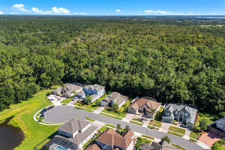 Aerial view of the front of the home and neighborhood.