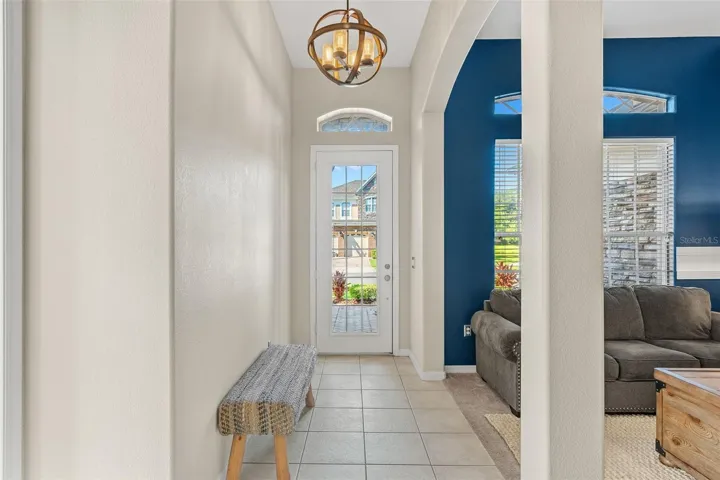 Step through the beautiful GLASS-PANELED FRONT DOOR and take in the graceful ARCHITECTURAL ARCHWAYS and CUTOUTS that add character and an elegant sense of flow throughout the home.