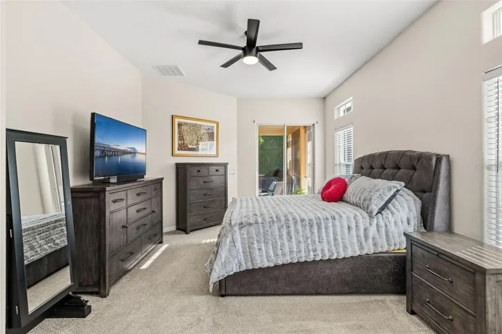 The spacious PRIMARY SUITE enjoys its own private wing and features sliding-door access to the rear lanai, DUAL WALK-IN CLOSETS and a well-appointed en-suite bath.