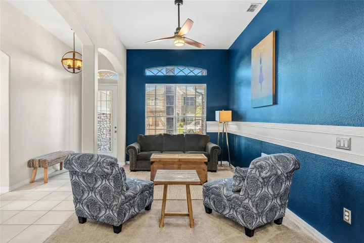 The thoughtful 3-WAY SPLIT FLOOR PLAN offers exceptional flexibility and privacy with a FORMAL LIVING ROOM positioned toward the front of the home.