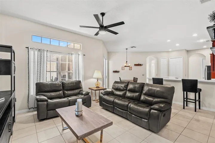 The nearby Dining area overlooks the Family Room, where the room is flooded with an abundance of NATURAL LIGHT.