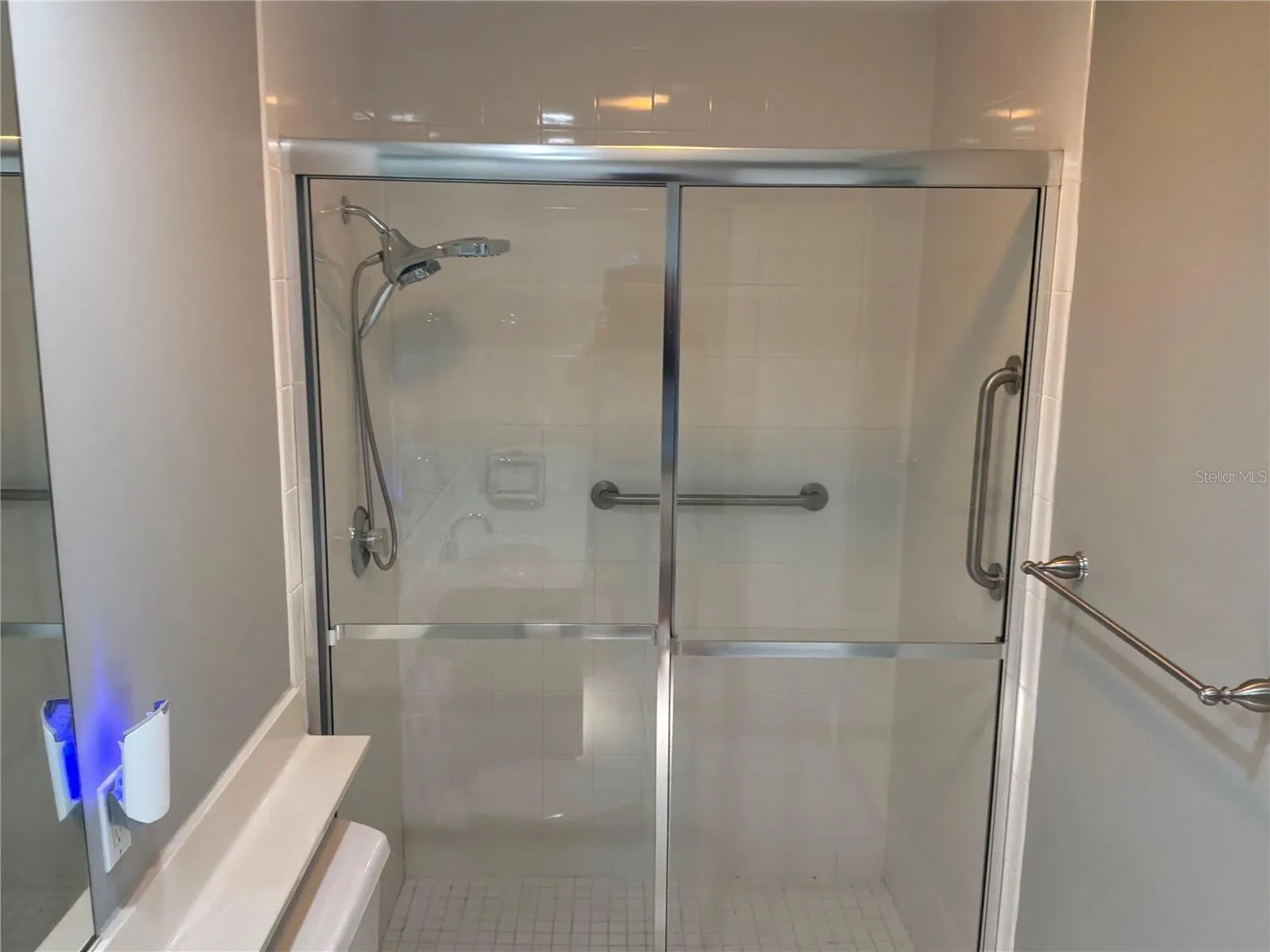 Walk-in shower with safety bars