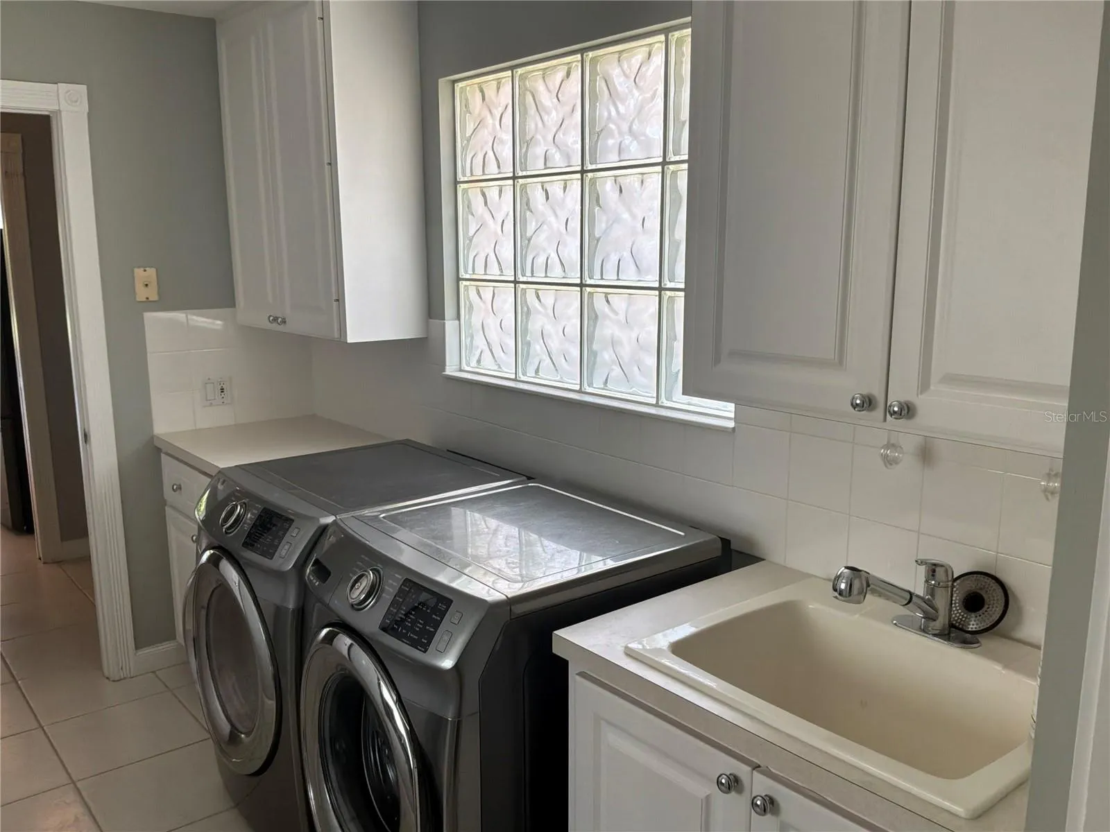 Laundry room with storage cabinets