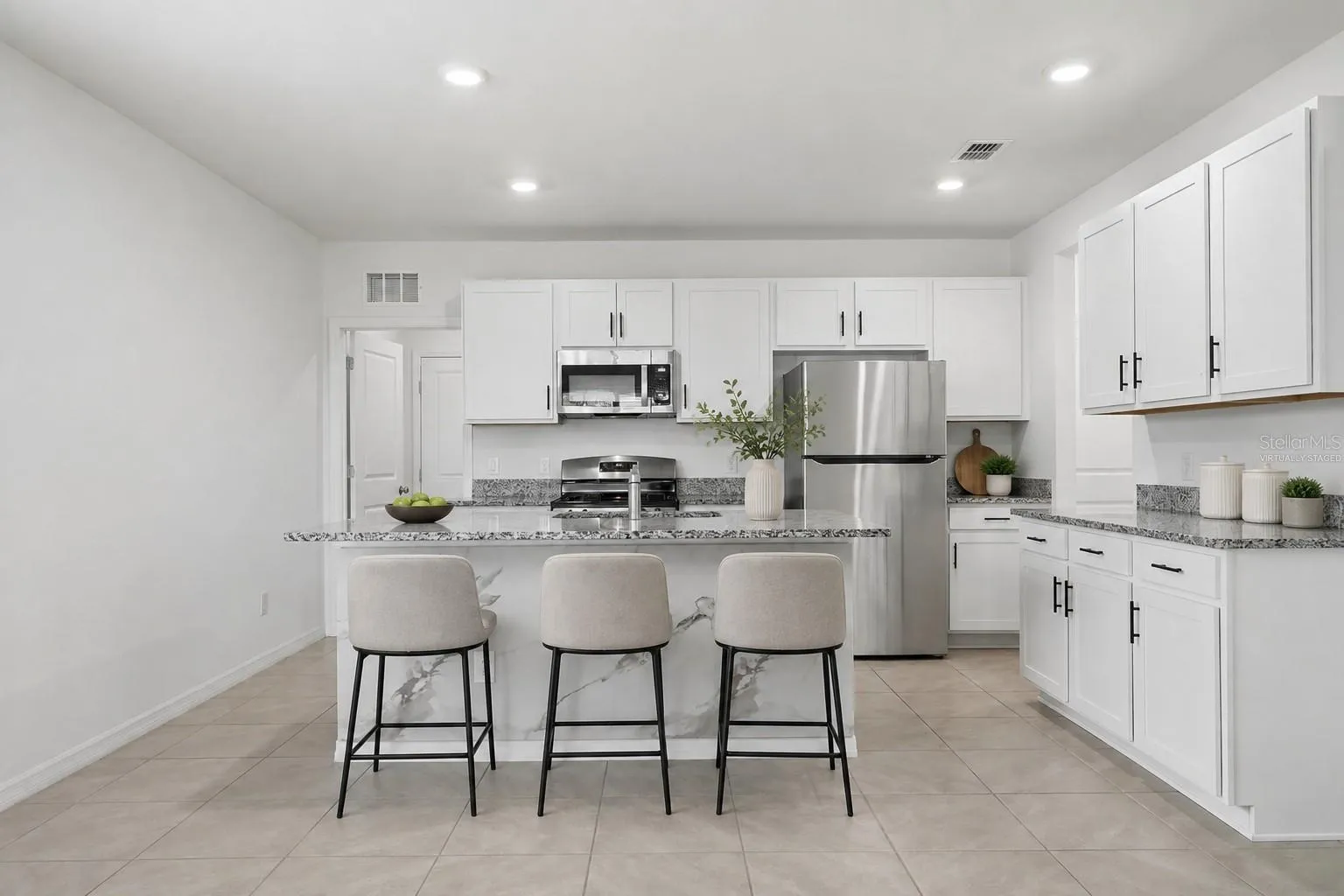 Virtually staged kitchen island illustrating seating and styling possibilities