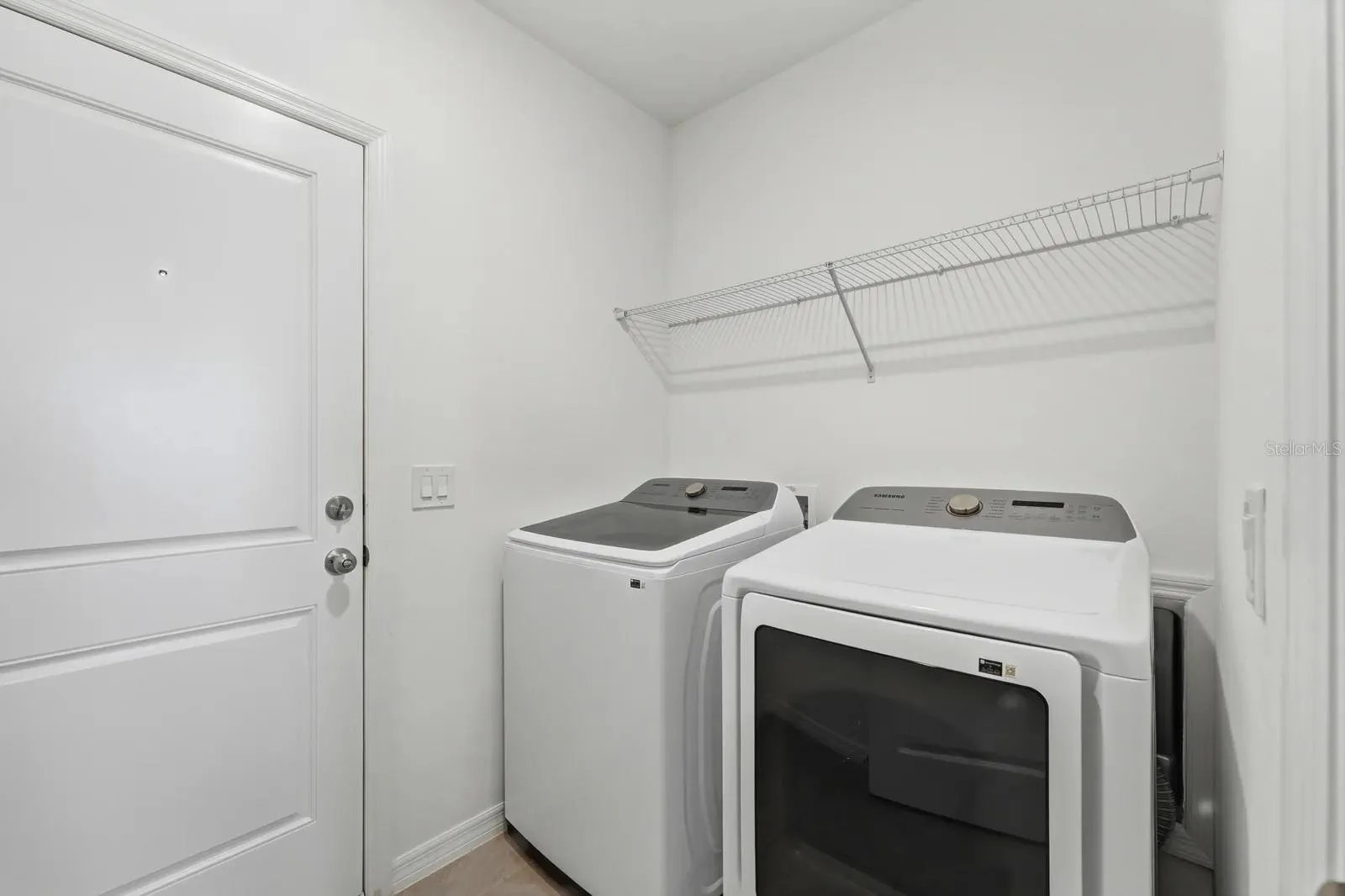 Laundry room with washer and dryer included