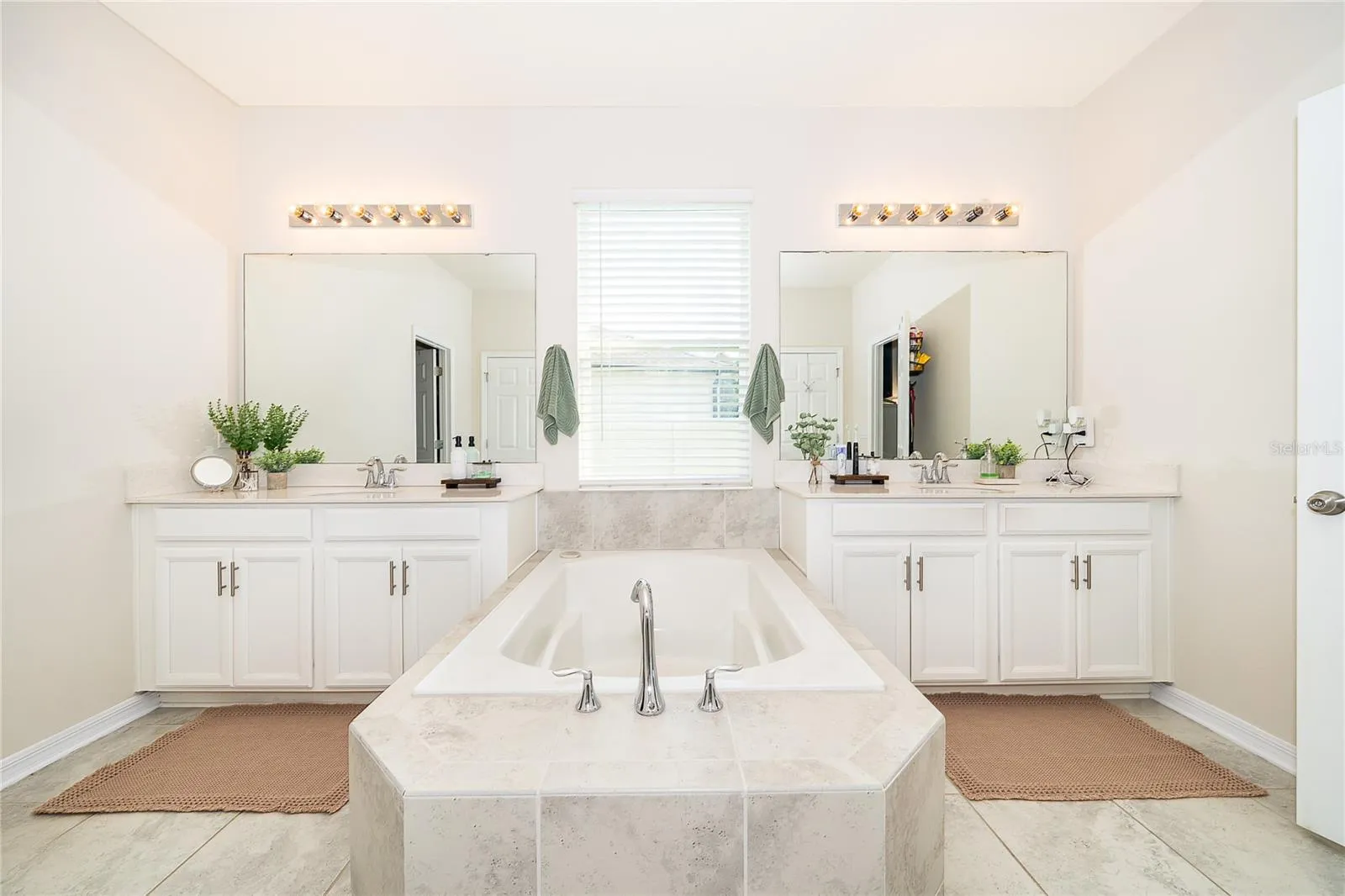 Beautifully designed primary bathroom offering comfort, convenience, and a refined atmosphere.