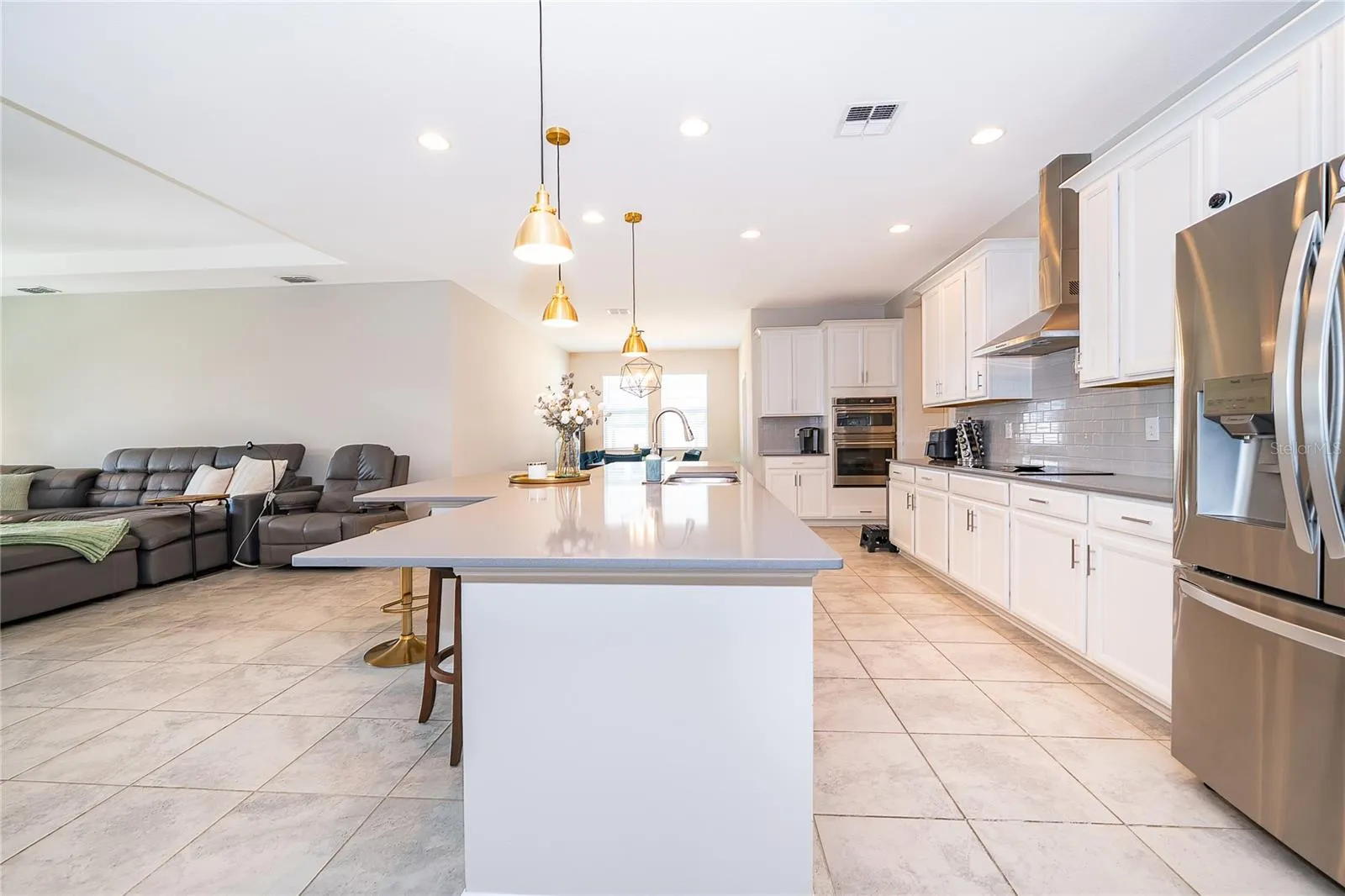 Kitchen island creates the perfect gathering space for family and guests.