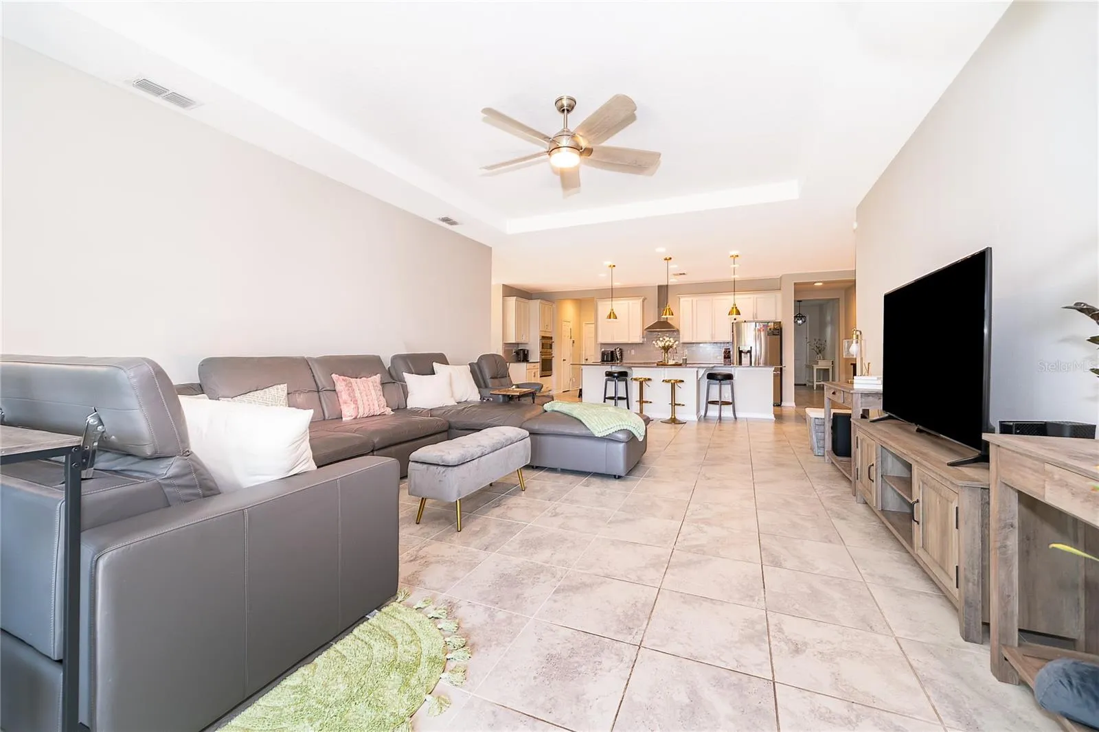 Expansive open-concept living space offering a seamless flow between the kitchen and main living areas.