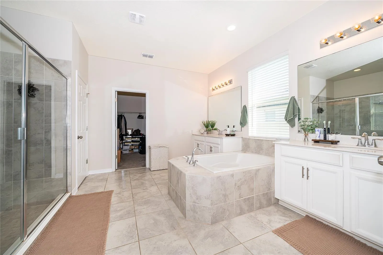 Beautifully appointed primary bath designed to create a private spa-like retreat.