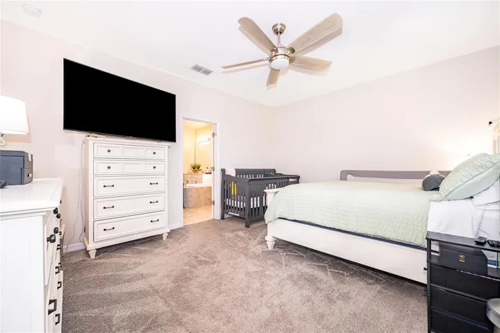 Generously sized primary suite designed as a peaceful private retreat.