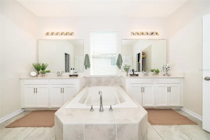 Beautifully designed primary bathroom offering comfort, convenience, and a refined atmosphere.