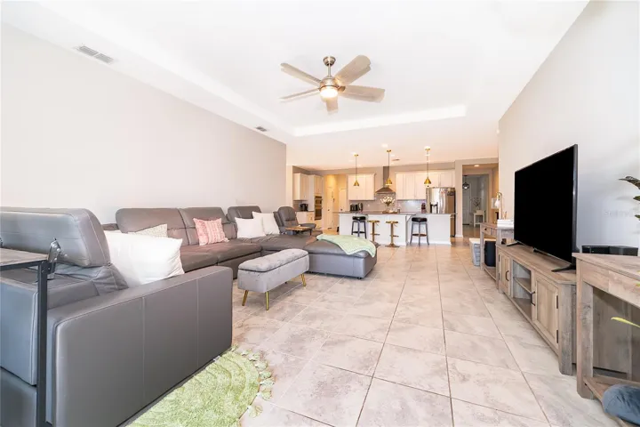 Expansive open-concept living space offering a seamless flow between the kitchen and main living areas.