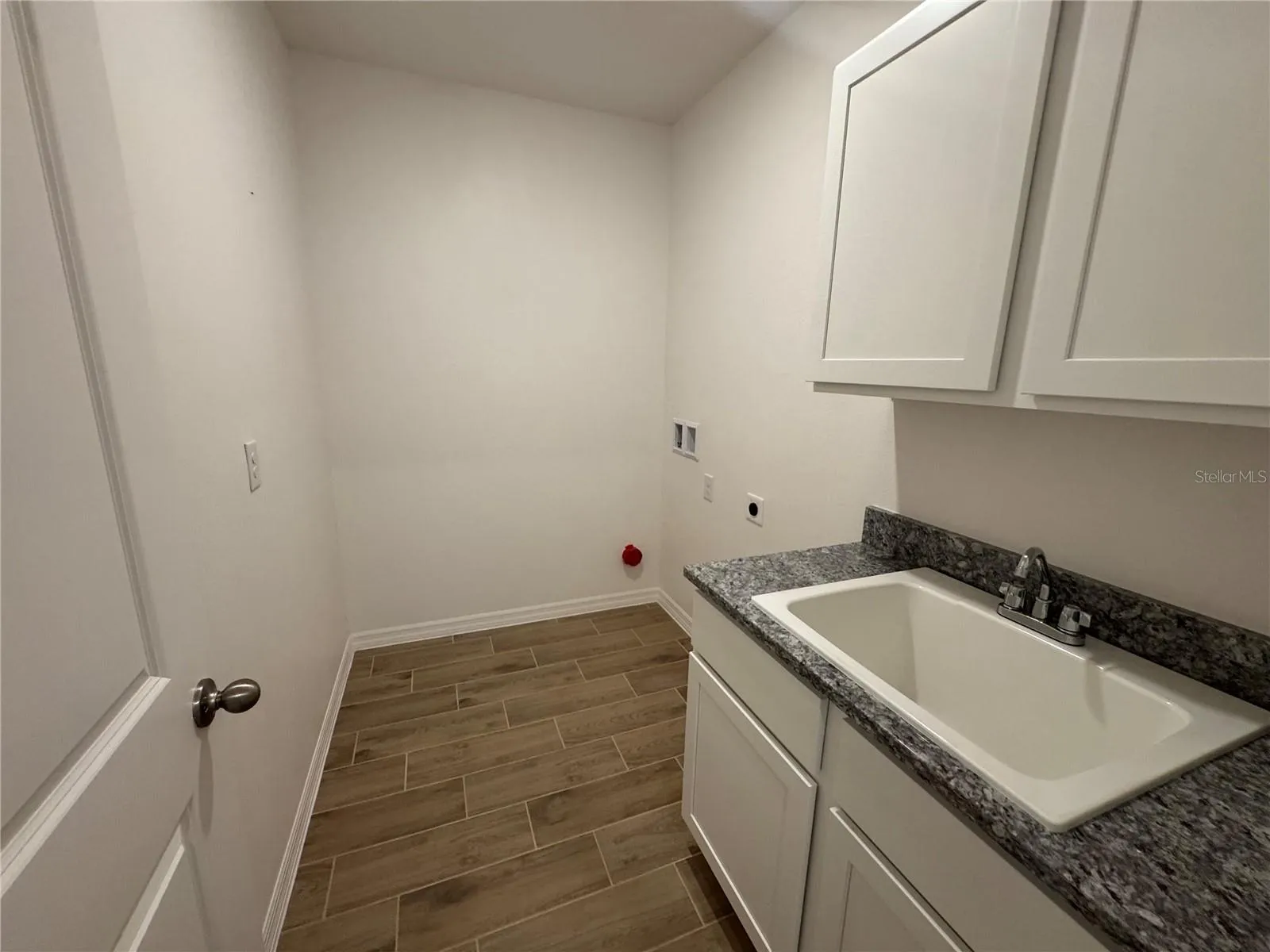 Laundry Room with upper & lower cabinets & utility sink