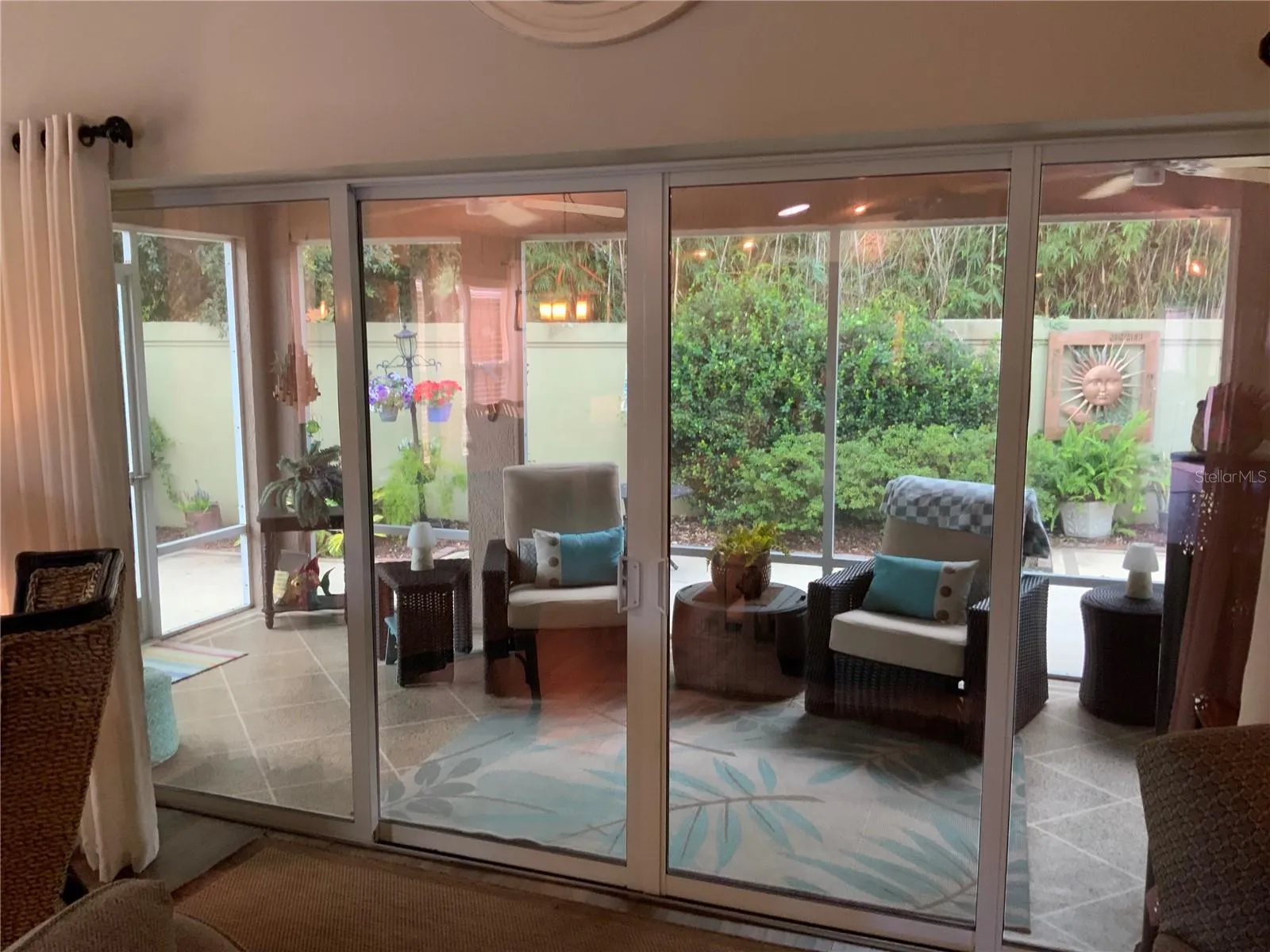 Looking out to the  lanai area and backyard.