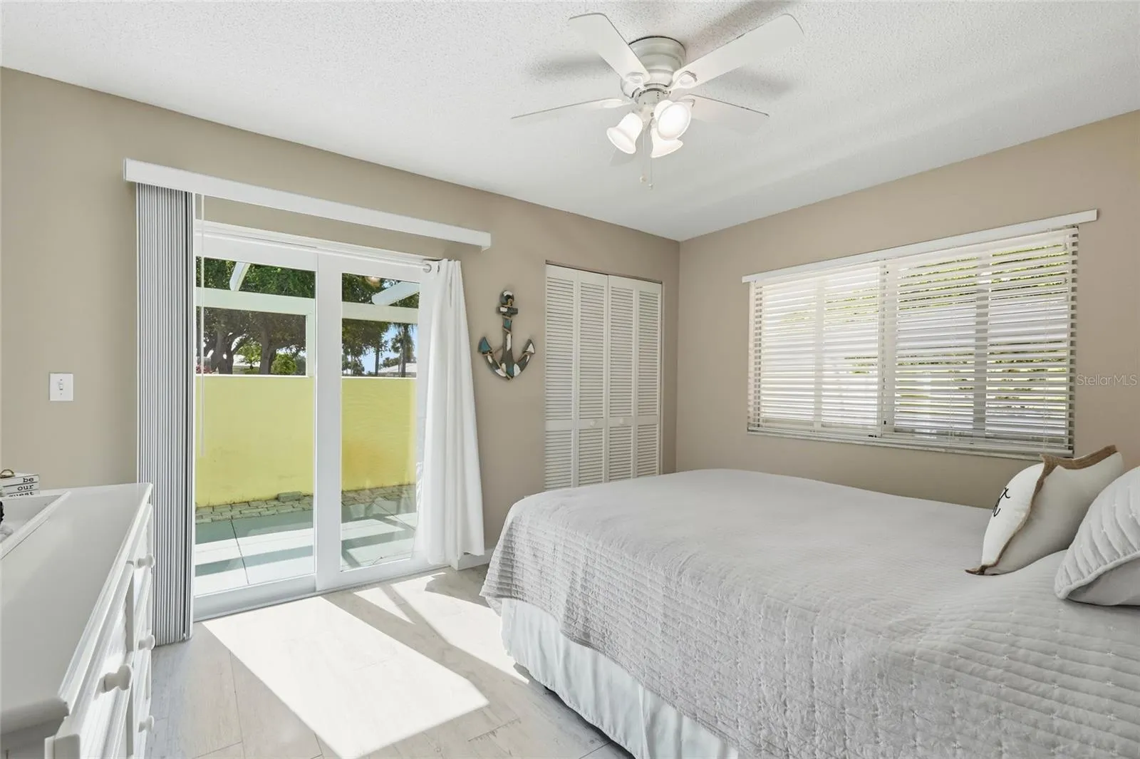 Guest Bedroom with hurricane impact sliding door.