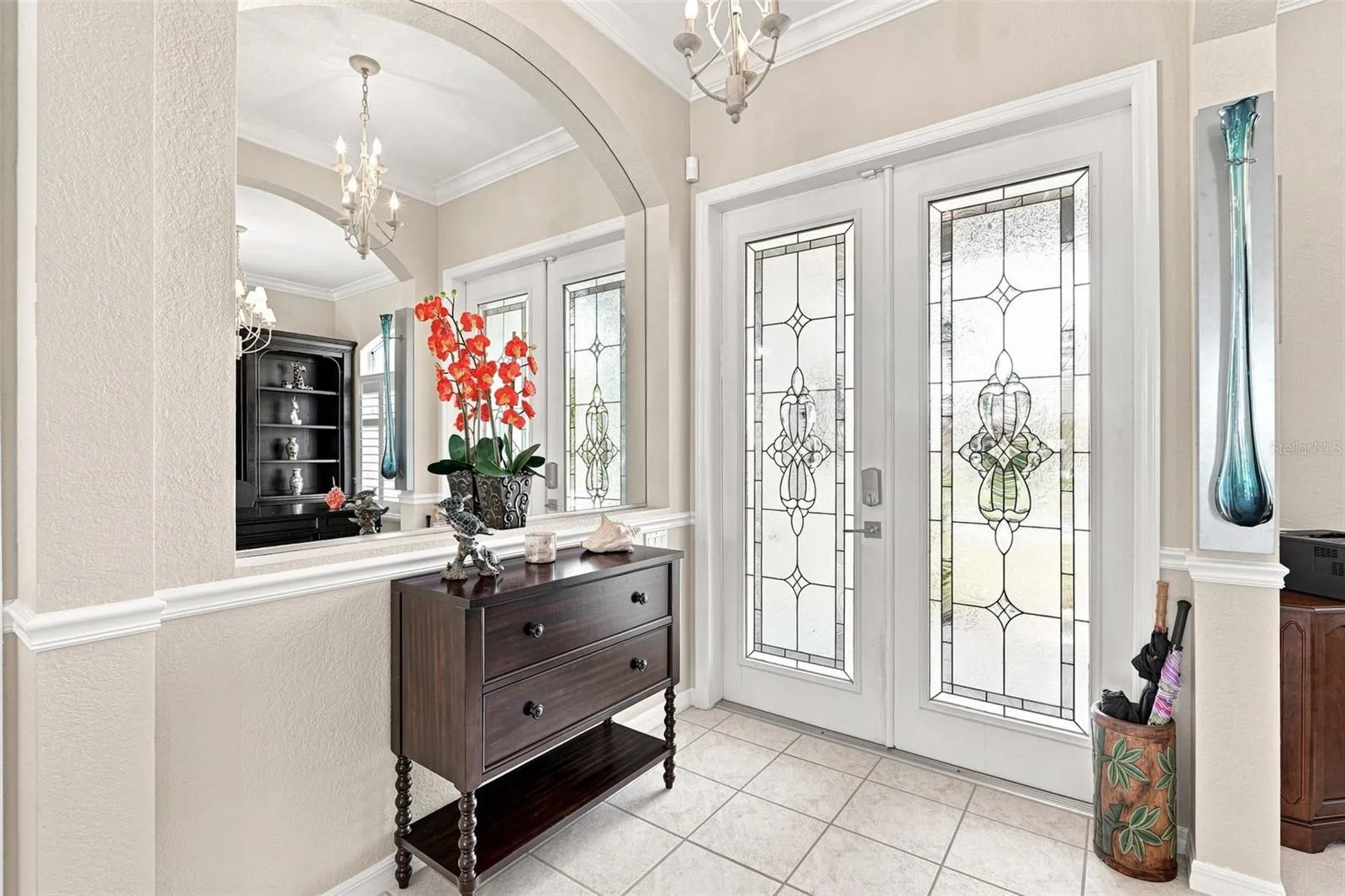 Sophisticated Entryway with Decorative Glass Double Doors