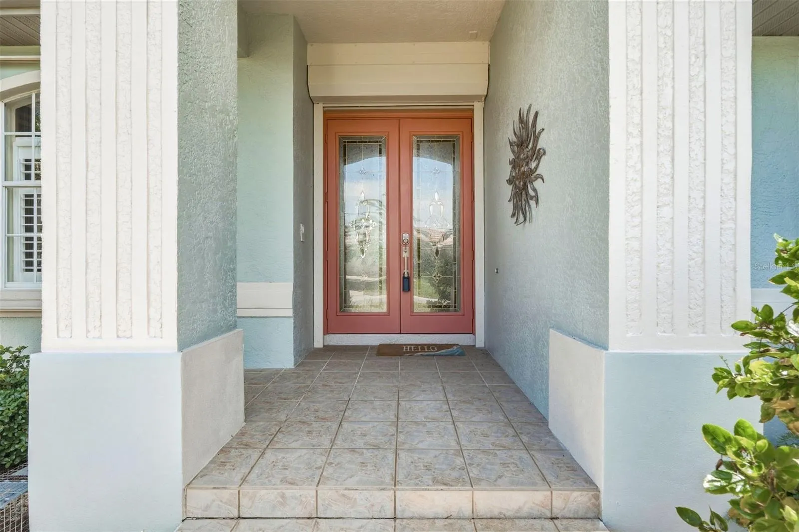 Welcoming Covered Front Entry with Leaded Glass Double Doors