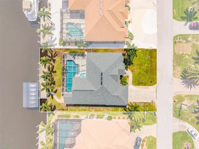 Overhead View of Home, Pool & Sailboat Canal