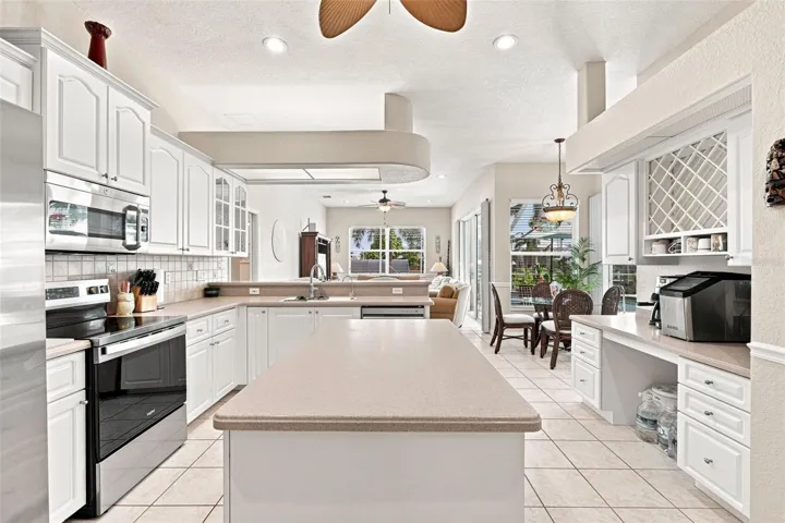 Rich Corian Countertops and Island Prep Area